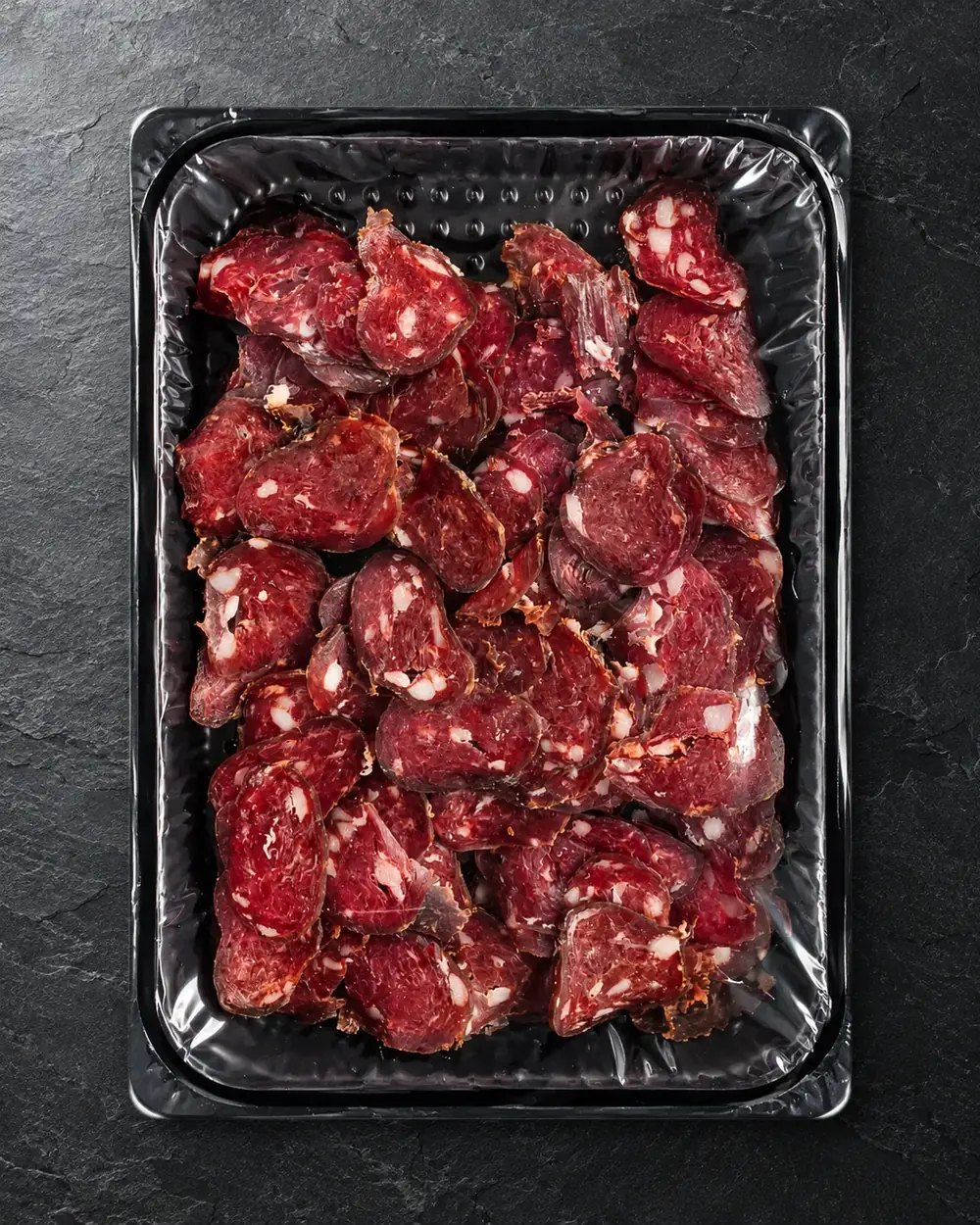 Saucisse de bœuf fumée à la voûte, en tranches, du Fumoir de Champoz.